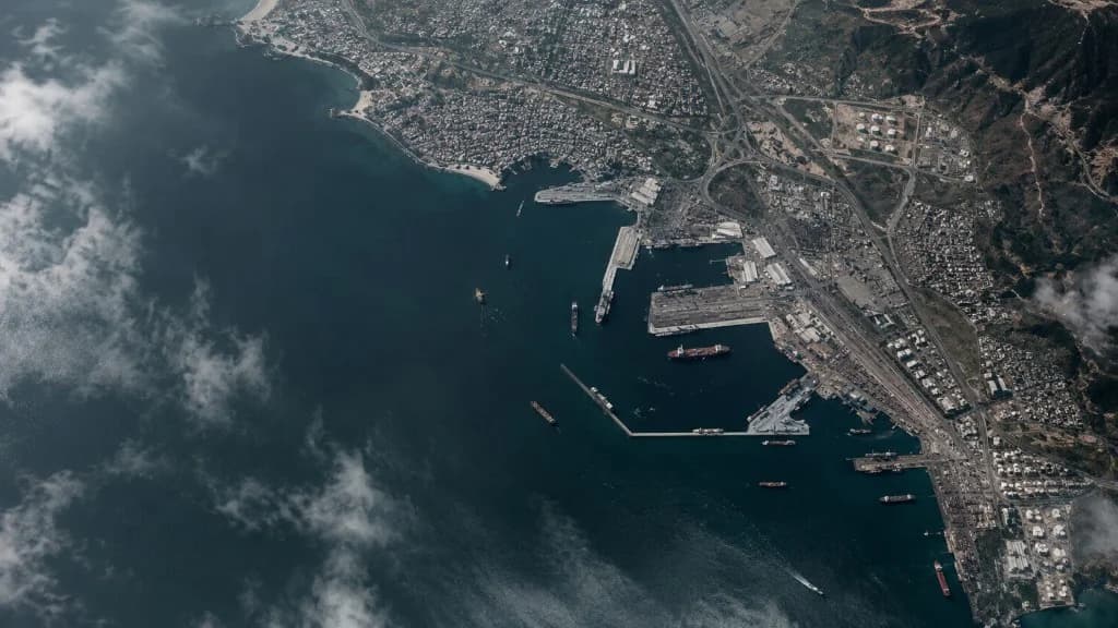 Aerial view of a coastal port and city